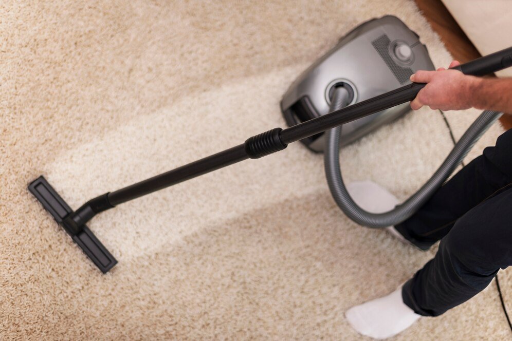 close-up-vacuuming-carpet_329181-636